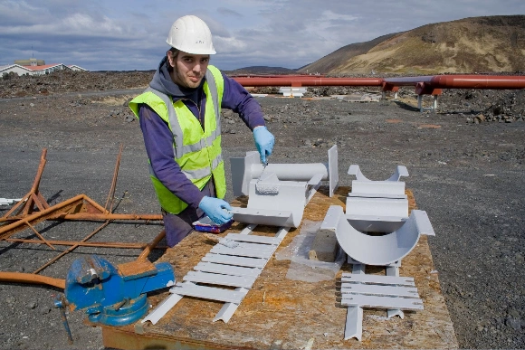 Worker at geothermal energy plant